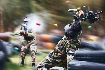 Image showing Paintball, sport and action with gun for shooting, speed and military battlefield with soldier, war and fitness outdoor. People together in camouflage, mask with weapon and game, power and lifestyle