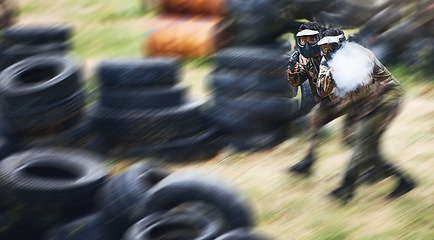 Image showing Blurry, moving and team playing paintball with action, military clothes and running during a game in Australia. War, sport and friends with blurred motion during fun, playful and outdoor competition