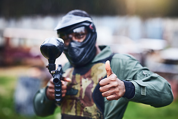 Image showing Paintball gun, man and portrait with mask, camouflage clothes and thumbs up to start outdoor combat game. Helmet head, war games and adventure for training, shooting or tactical development training