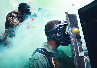 Image showing Paintball team, shooting together and war game with shield, mask or tactical strategy for safety, competition or contest. Outdoor teamwork, team building and vision with weapon, combat and friends