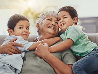 Image showing Children, hug and grandmother on a sofa, happy and smile, love and laugh while bonding on their home visit. Kids, grandchildren and boy embrace grandma on a couch, relax and hugging in a living room