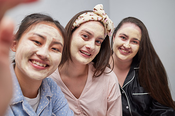 Image showing Friends, women and sleepover with mask, selfie and bonding with cosmetics, smile and quality time. Females, girls and photo for posting, dermatology or skincare with ladies, treatment or fun together