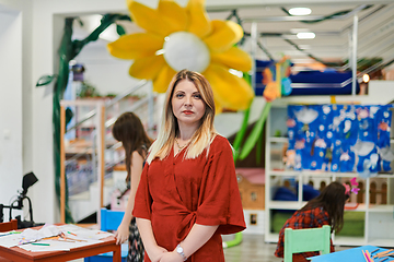 Image showing Portrait of a teacher in a preschool institution, in the background of the classrooms