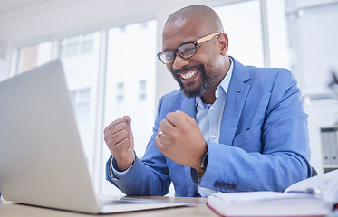 Image showing Black man, laptop and fist celebration in office for web design success, happiness or winner achievement. African businessman, celebrate and happy hands for online communication on digital device