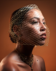 Image showing Net veil, retro and face of a fashionable woman of fashion isolated on a brown studio background. Elegance, makeup and stylish vintage model with a fancy, classic and glamour accessory on a backdrop