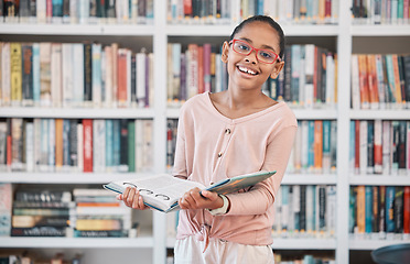 Image showing Girl, library book and portrait of a school student ready for learning, reading and studying. Children, knowledge development and education center with a study bookshelf and kid with a happy smile