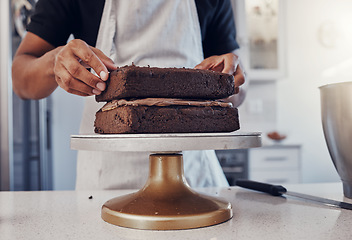 Image showing Layering, preparation and hands of a man with a cake for a birthday, dessert and sweet treat. Kitchen, working and chef in a bakery baking food, confectionery and unhealhy snack on a counter