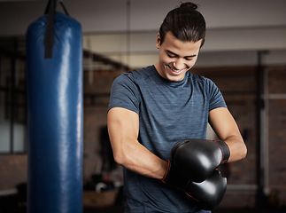 Image showing Fitness, boxing and man with gloves in gym for sport training, exercise or challenge. Happy, smile and male athlete or boxer doing cardio kickboxing workout for health or wellness in sports studio.