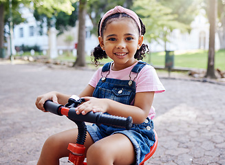 Image showing Portrait, young girl on bike in park and happy child outdoor with nature and freedom, smile while riding. Travel, happiness and adventure, growth and childhood with family day out and cycling mockup