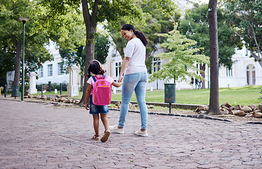 Image showing Kindergarten, student and mother with daughter walking to school, relax and bonding while holding hands. First day, elementary and girl with mama on commute, morning travel, talking and sweet