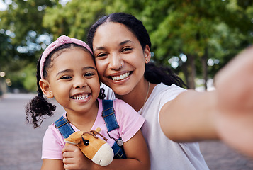 Image showing Girl, mom and selfie of a mother and kids portrait in a park with a happy smile outdoor. Happiness, family and mama love with parent care for child on vacation together of a woman and young person