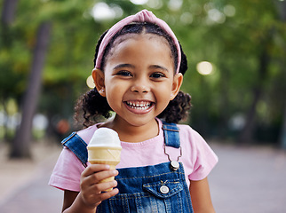 Image showing Portrait, young girl with ice cream in park, happy child outdoor with nature and freedom, dessert and smile. Travel, happiness and adventure, growth and childhood with family day out and youth mockup