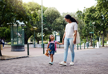 Image showing Park, walking and mom holding hands with girl enjoy weekend, summer holiday and adventure outdoors. Love, black family and mother with child in morning for back to school, kindergarten and education