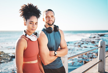 Image showing Portrait, exercise and serious with a couple by the sea for a workout or running for cardio and endurance together. Fitness, runner and mockup with a sports man and woman training by the ocean