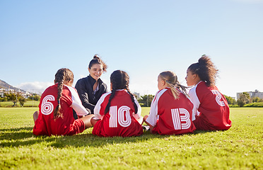 Image showing Team building, planning or coach with children for soccer strategy, training and sports goals in Canada. Sport, friends and woman coaching group of girls on football field for game, match or workout