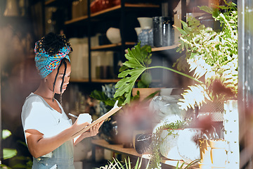 Image showing Checklist, small business or black woman writing flowers for plants quality control or stock inventory. Agro management, store manager or entrepreneur planning or working on floral growth inspection