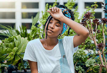 Image showing Tired, gardener or black woman with fatigue, burnout or stress after cleaning dirty plants or flowers. Gardening, sweating or exhausted girl resting after working on environmental maintenance job