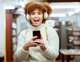 Image showing University student, woman and phone for texting, library and headphones for streaming music, happy and online. Gen z girl, smartphone and social media app for chat communication on internet at campus