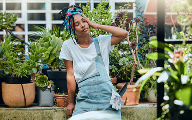 Image showing Tired, gardener or black woman with headache, stress or burnout after cleaning dirty plants or flowers. Gardening, fatigue or exhausted girl resting after working on environmental maintenance job