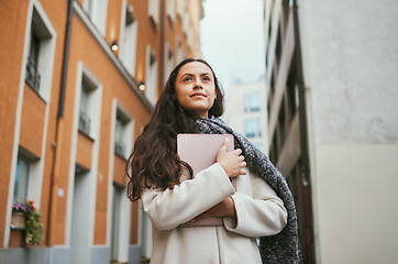 Image showing Woman, tablet and idea in a city of a freelance travel writer thinking of buildings architecture. Writing, tech and worker by a urban building with a happy smile about holiday traveling for work