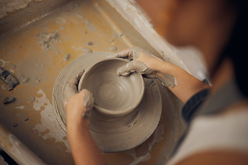 Image showing Clay, pottery or hands in workshop studio working on a cup sculpture or mug mold in small business. Creative, artistic person or talented worker manufacturing handicraft products in designing process