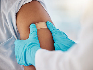 Image showing Covid, vaccine and plaster on the arm of a black man patient in a hospital for an injection or healthcare. Doctor, medical and insurance with a male in a clinc for her corona virus vaccination