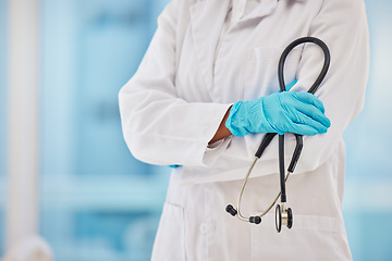 Image showing Cardiology, stethoscope and proud doctor hands for healthcare, heart wellness and insurance in hospital. Medical blurred background, professional and cardiologist with career equipment in clinic zoom