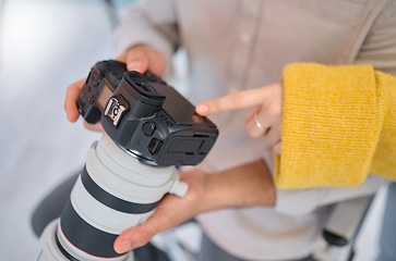 Image showing Camera, hands and photography for a digital agency or magazine company looking at tech setting. Employee, model and photographer review photo quality in a studio busy with creative working for art