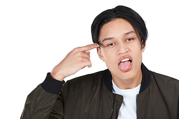 Image showing Portrait, rude and crazy with an asian man in studio isolated on a white background pointing at his head. Face, angry and frustrated with a young male on blank space making a gesture in disrespect