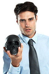 Image showing Portrait, businessman and black skull in hand in studio for death, symbol and failure on a white background. Face, man and skeleton for research, emoji and magic, hypnosis or horror, end and isolated