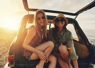 Image showing Women friends, portrait and car trunk on road trip, beach or relax on holiday for sunset with smile. Woman, outdoor and friendship happiness, ocean vacation or sunglasses for summer sunshine together