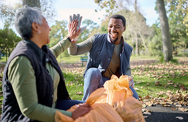 Image showing High five, volunteer cleaning and people celebrate cleaning garbage, pollution or waste product for environment support. Community, NGO charity and eco friendly team help with nature plastic clean up