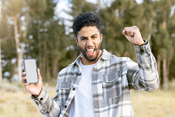 Image showing Phone mockup, portrait and man excited for nature adventure, forest hiking or celebrate outdoor woods journey. UI screen mock up, digital product placement and happy person cheer, fist pump and shout