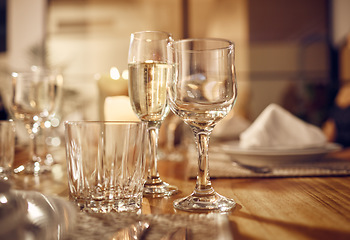 Image showing Drink, glass and dinner with party, celebration event with glassware, elegant and luxury in restaurant or banquet. Table setting, alcohol and lifestyle, fine dining with decoration and celebrate