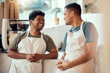 Image showing Coffee shop, happy and male barista talking to his colleague before work at a restaurant or cafe. Happiness, smile and men waiter or server in discussion or conversation at the counter by cafeteria.