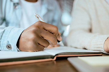 Image showing Closeup, black man hand and writing in notebook at desk for studying, planning and support for goals. Student men, book and pen for brainstorming, vision or thinking together for university success