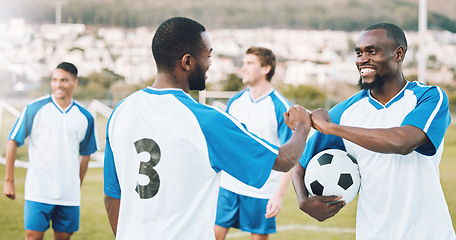 Image showing Fist bump, soccer team and fitness teamwork success of a sports group in training on a grass field. Football friends, support and exercise support with motivation outdoor for health workout and smile