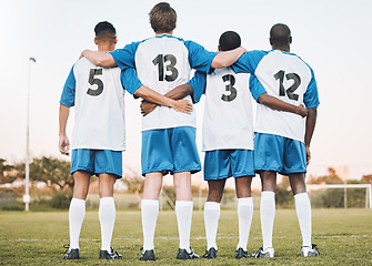 Image showing Soccer, team and hug standing with back on the field in partnership, trust or ready for sports game or match. Sport men hugging in teamwork, collaboration or unity for fitness, training or workout