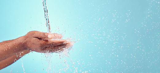 Image showing Water stream, splash and black hands with mockup for cleaning and morning hand cleaning. Blue background, mock up and person with skincare, sustainable dermatology and clean health safety in studio