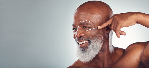 Image showing Skincare, face cream and senior man in studio for wellness, beauty and grooming against grey background. Facial, skin and elderly model relax with luxury, cosmetics and wrinkle product while isolated