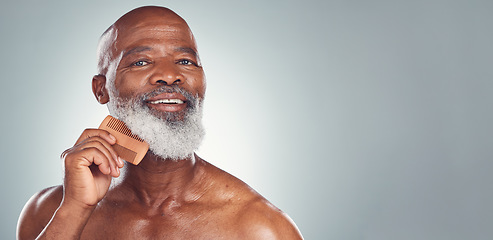 Image showing Grooming, comb and beard with face of black man for beauty, hygiene and skincare with mockup. Self care, facial hair and barber with model for health, wellness and cleaning in studio background