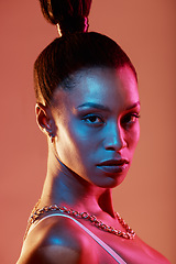 Image showing Neon lighting, cyberpunk and portrait of a woman with makeup isolated on a brown studio background. Fashion, futuristic and face of a model with creative beauty, coametics and glow on a backdrop