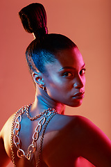 Image showing Beauty, jewellery and portrait of a woman in a studio with neon lights for aesthetic and cosmetics. Makeup, art and young female model with a cosmetic routine with jewelry posing by orange background