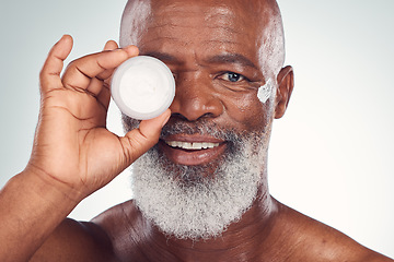 Image showing Facial cream, skincare and portrait of black man in studio for wellness, dermatology and healthy skin. Beauty products, advertising and face of senior male with lotion, creme or anti aging treatment