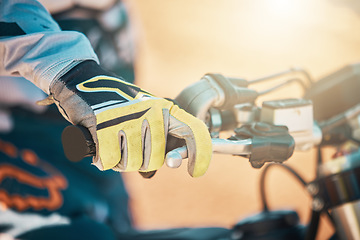 Image showing Moto cross, glove hand and motorcycle with a athlete ready for adventure sport and competition. Motorbike drive training, dirt bike and sports of a man doing fitness challenge for performance