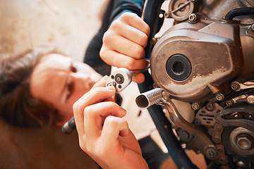 Image showing Hands, mechanic and engine repairs working on motor with tools for racing, safety or mechanical part. Hand of engineer fixing motorbike, transport or transmission on automobile or vehicle in workshop