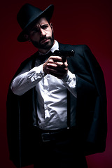 Image showing Assassin, suit or shooting gun on studio background in dark secret spy, isolated mafia leadership or crime security. Model, gangster or hitman weapon in aim, formal style or fashion clothes aesthetic