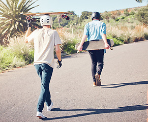 Image showing Skateboard, sports and friends walking in road ready for adventure, freedom and leisure exercise on mountain. Friendship, skateboarding and skater men with longboard for exercise, skating and fitness