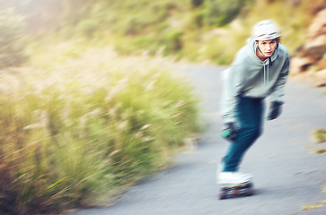 Image showing Skateboard, skating sports and man on road for fitness, exercise or wellness. Training, freedom and portrait of male skater moving with fast speed, skateboarding and riding alone outdoors for workout