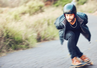 Image showing Skateboard, sports and man skating on road for fitness, exercise or wellness. Training, freedom and male skater moving with fast speed, skateboarding and riding alone outdoors for action or workout.